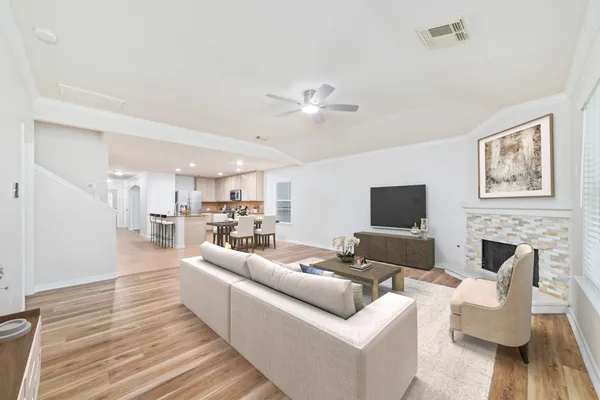 a living room with furniture fireplace and a flat screen tv