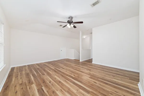 a bed room with a bed and a window