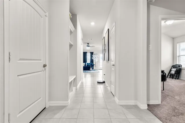 a view of a hallway with a furniture and a livingroom view