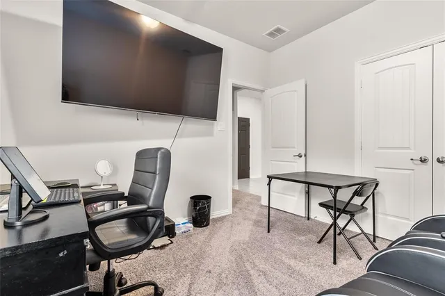 a view of workspace with wooden floor windows