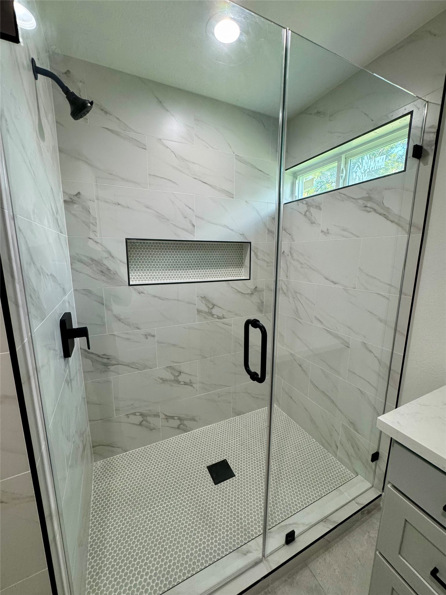 7322 Laredo Street Houston, TX 77020 - Photo 11 of 17 a bathroom with a glass shower door
