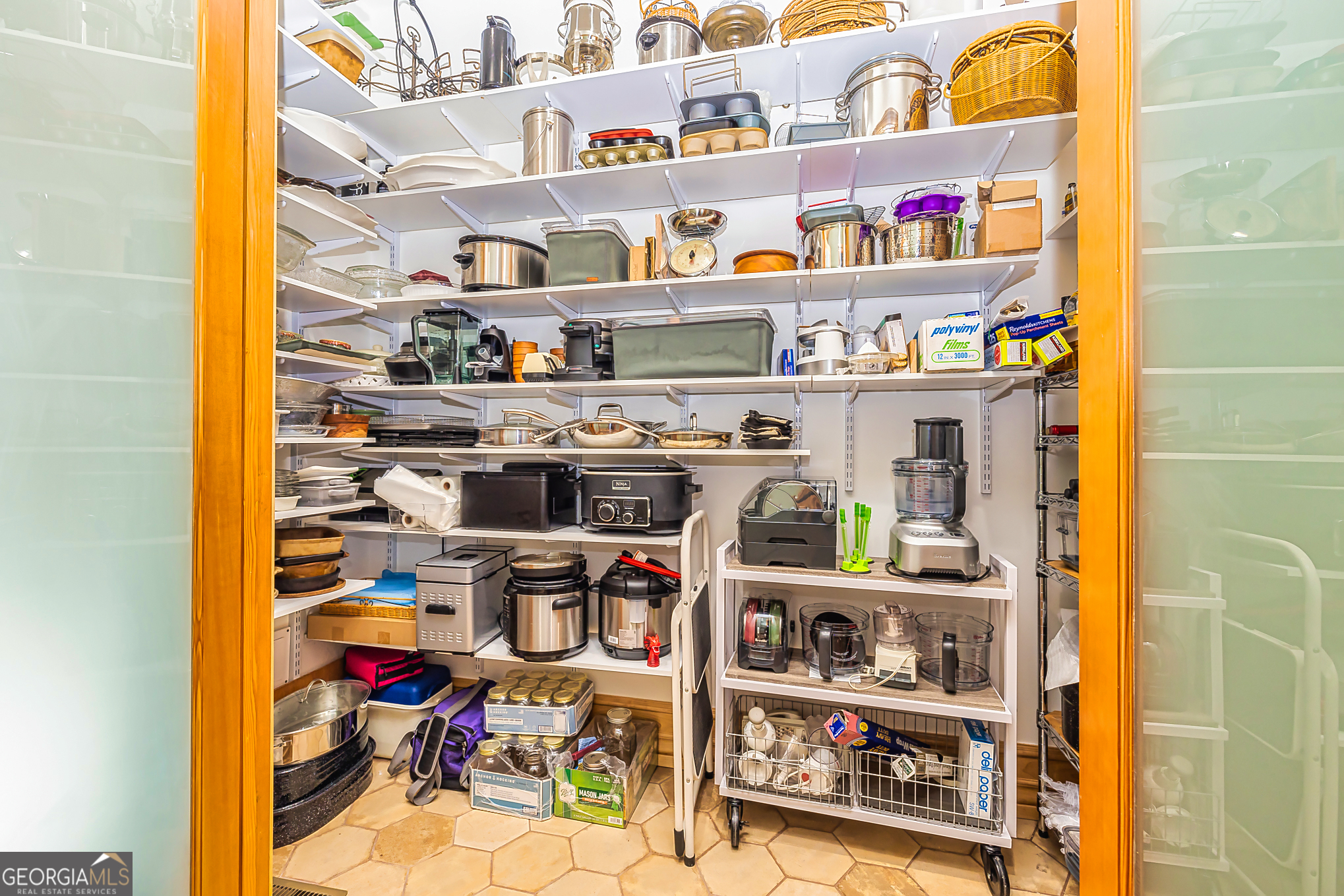 242 Kirkley Road Tyrone, GA 30290 - Photo 29 of 50 a view of walk in closet with clothes and shoes