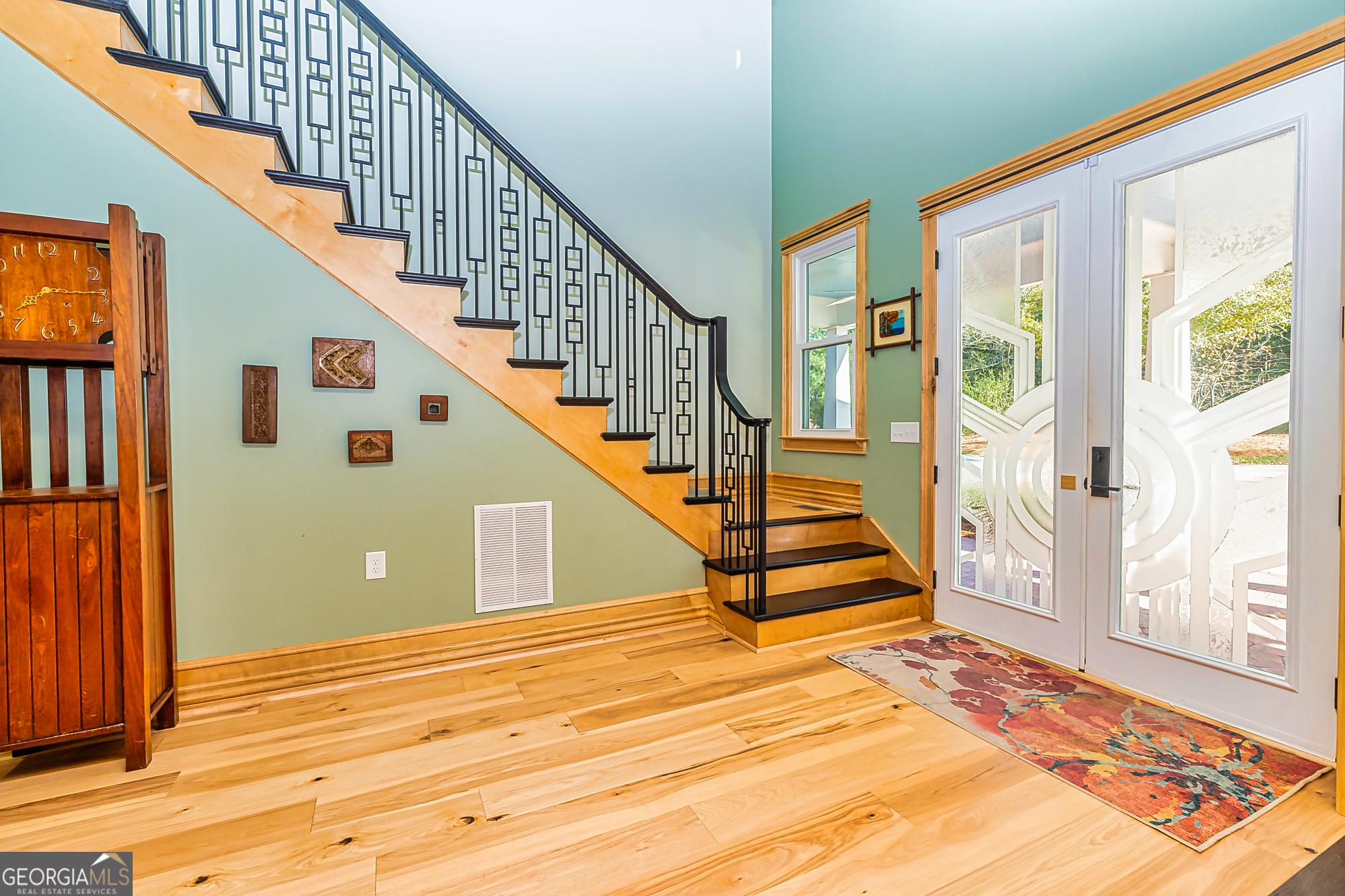 242 Kirkley Road Tyrone, GA 30290 - Photo 4 of 50 a view of an entryway with wooden floor and windows