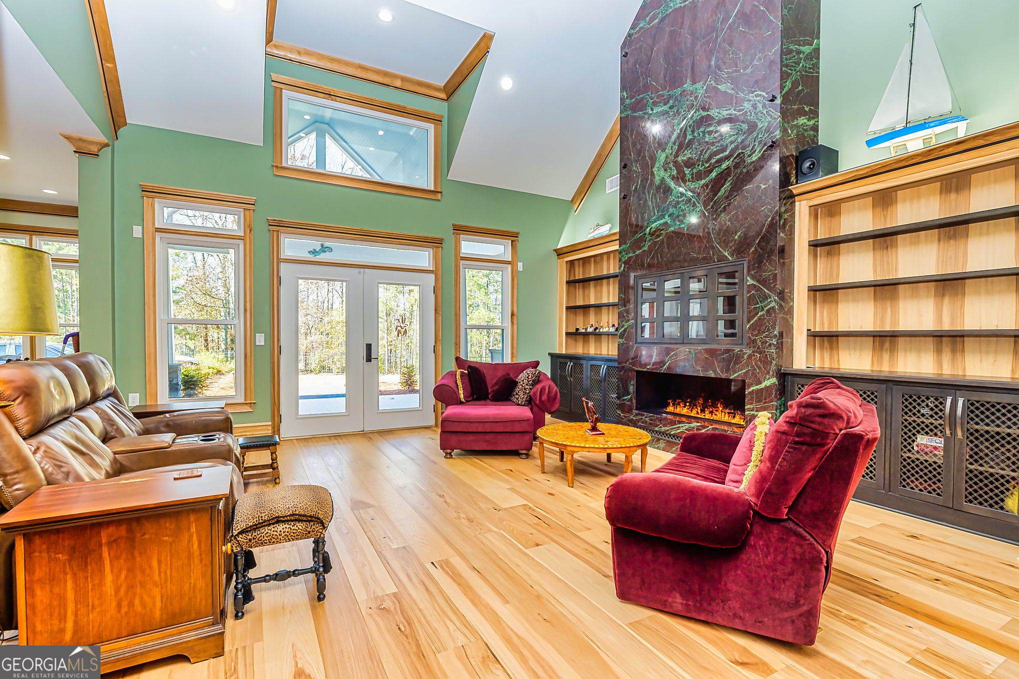 242 Kirkley Road Tyrone, GA 30290 - Photo 5 of 50 a living room with furniture a fireplace and large windows