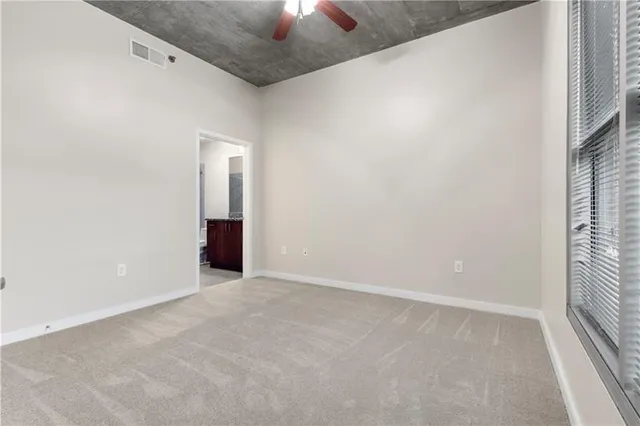 an empty room with a empty space and a window