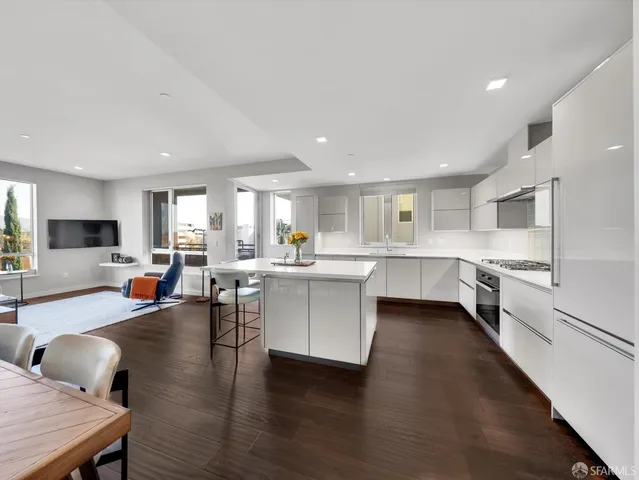 a kitchen with counter space wooden floor and appliances