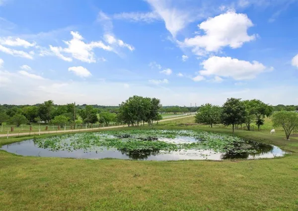 a view of a golf course with a lake