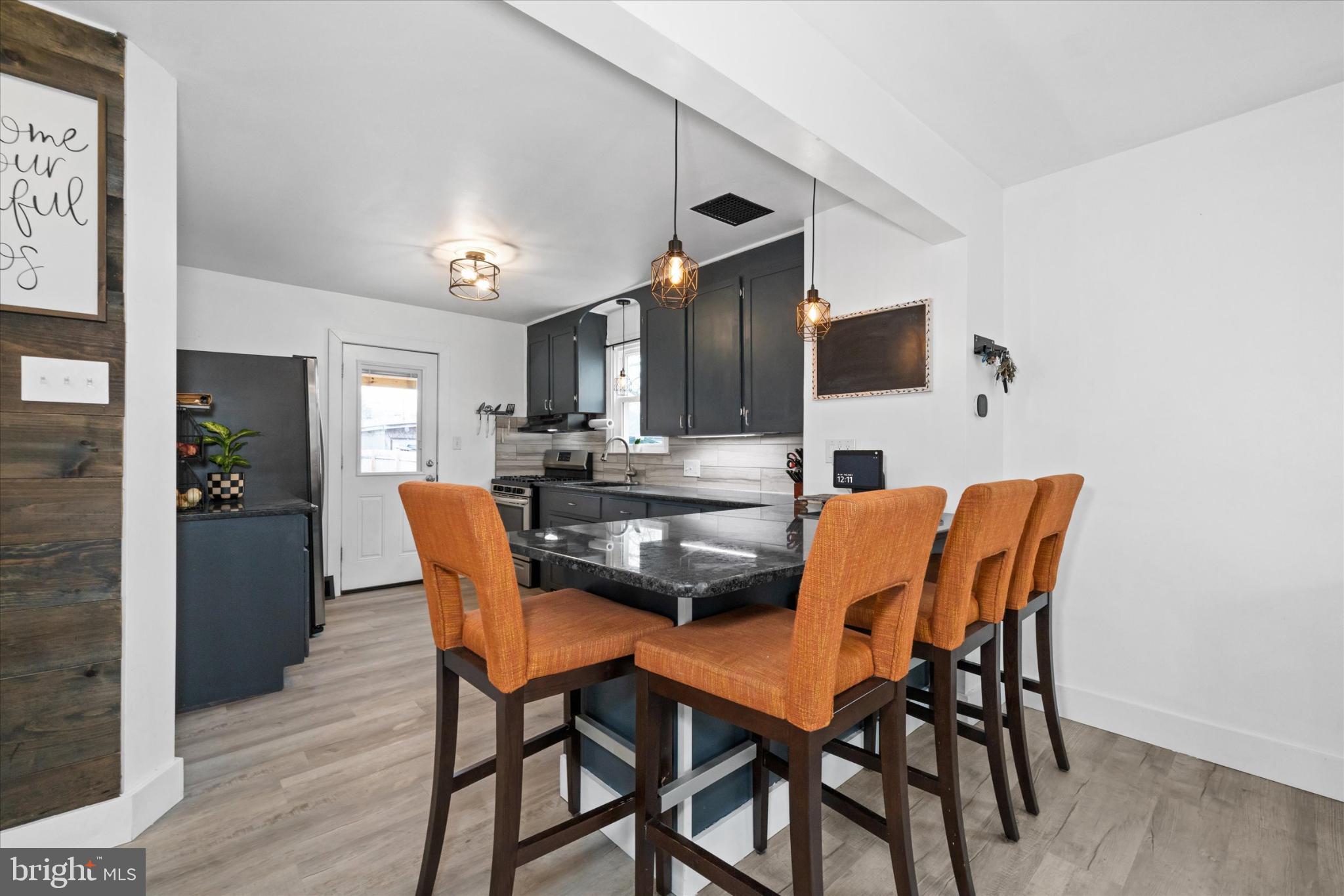 7 2nd Avenue New Castle, DE 19720 - Photo 34 of 44 Modern kitchen with stylish seating.