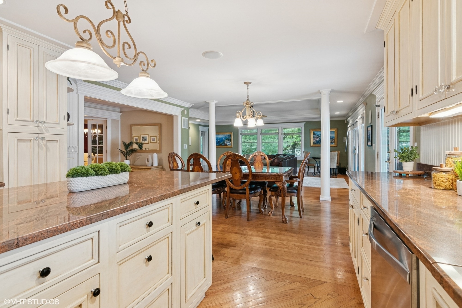 6730 South Madison Street Willowbrook, IL 60527 - Photo 14 of 52 a view of a dining room and livingroom with furniture wooden floor a chandelier