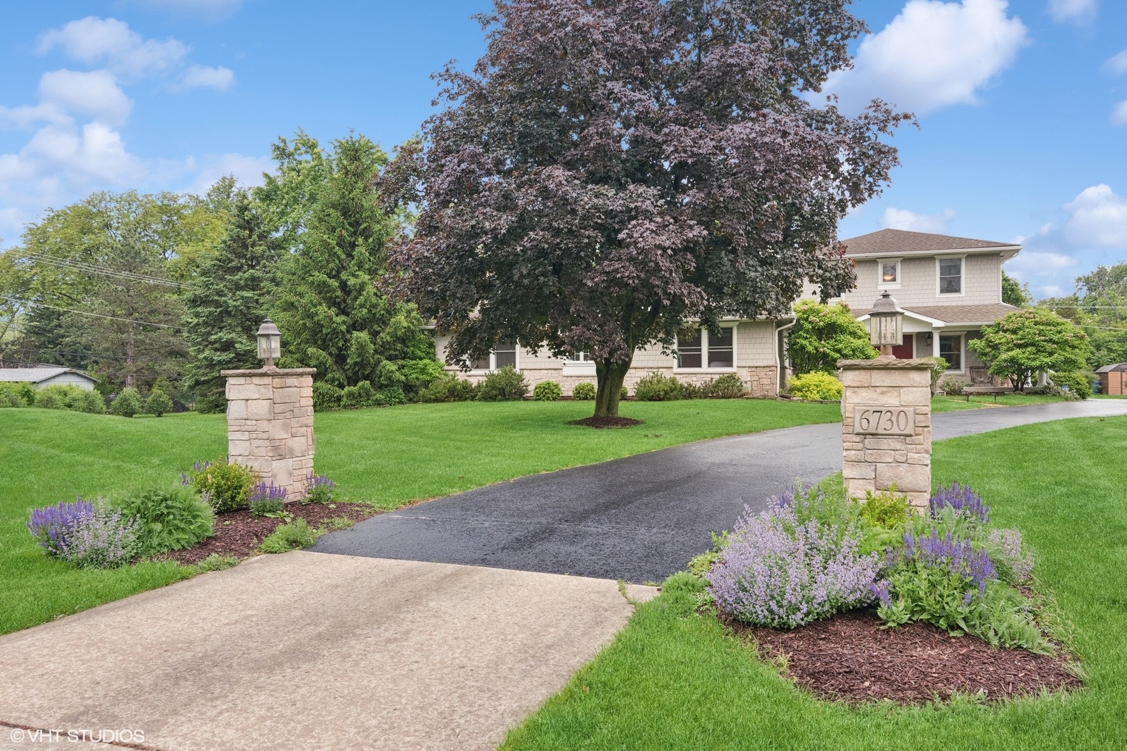 6730 South Madison Street Willowbrook, IL 60527 - Photo 3 of 52 a front view of a house with a yard and green space