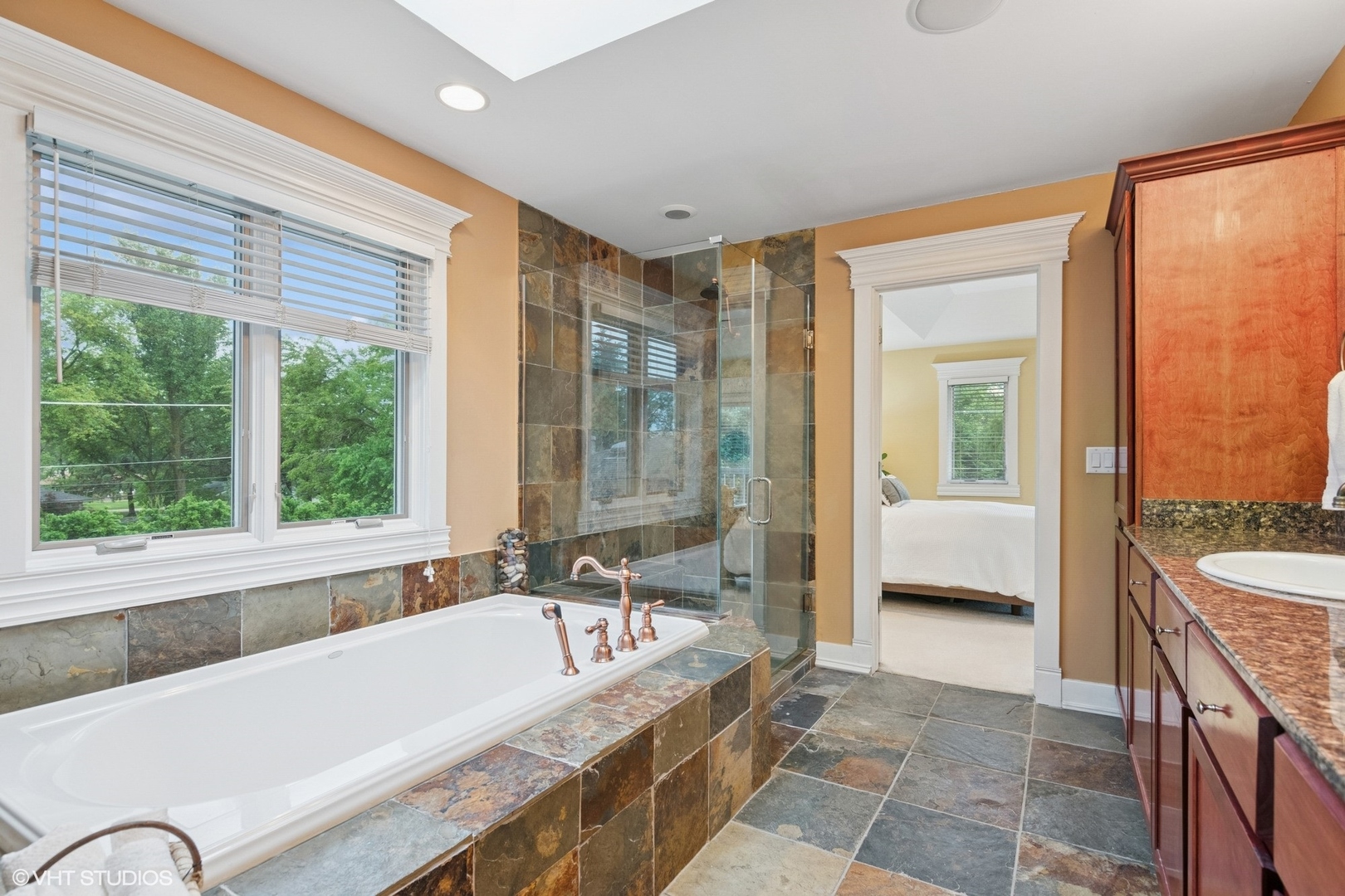 6730 South Madison Street Willowbrook, IL 60527 - Photo 39 of 52 a spacious bathroom with a granite countertop tub mirror and a sink