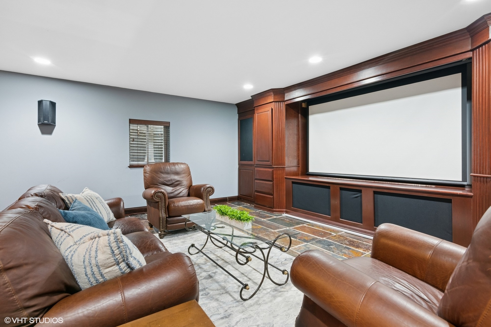 6730 South Madison Street Willowbrook, IL 60527 - Photo 40 of 52 a living room with furniture and a flat screen tv