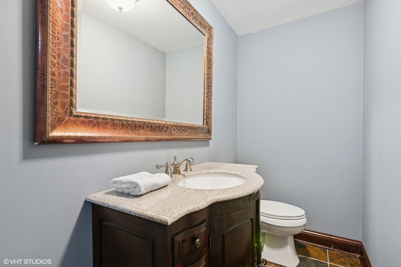 6730 South Madison Street Willowbrook, IL 60527 - Photo 42 of 52 a bathroom with a sink and a toilet