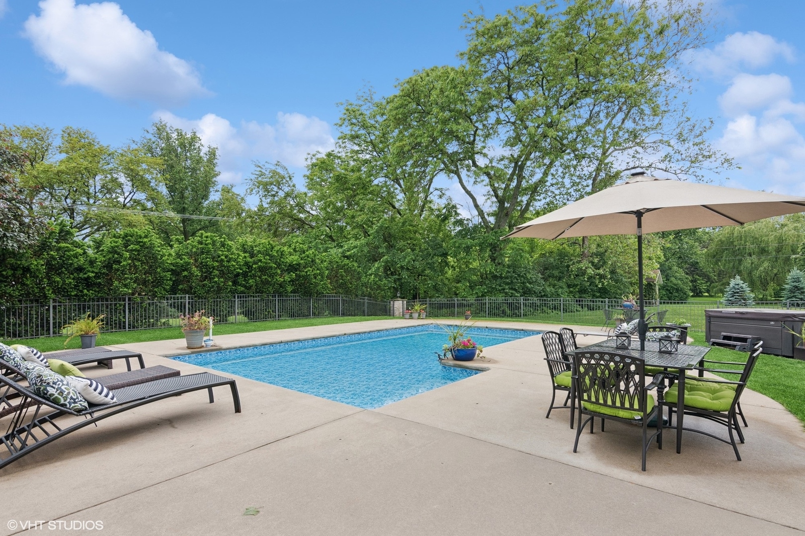 6730 South Madison Street Willowbrook, IL 60527 - Photo 49 of 52 an outdoor sitting area with furniture and umbrella