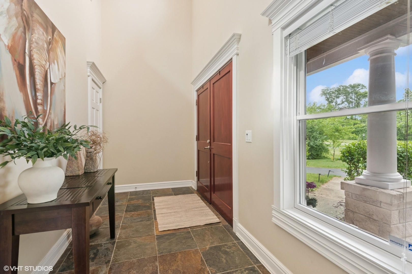 6730 South Madison Street Willowbrook, IL 60527 - Photo 6 of 52 a room with a table and a potted plant
