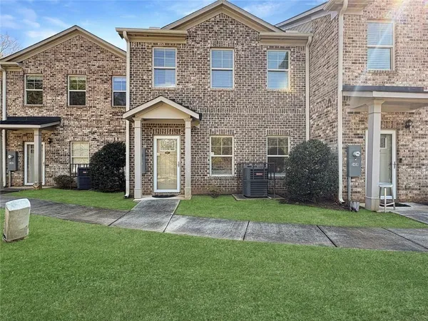 front view of a house with a yard