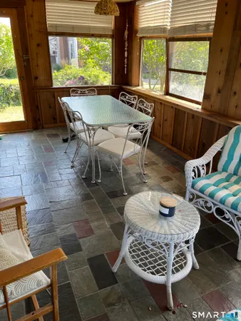 a living room with furniture a window and a table