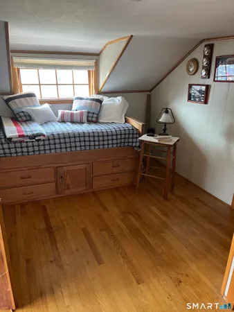 a bedroom with furniture and window