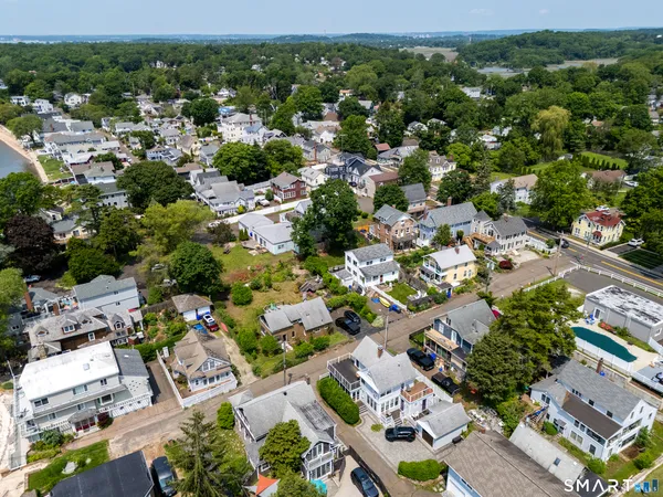 an aerial view of residential houses with outdoor space