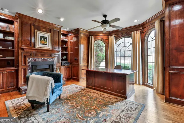a kitchen with kitchen island granite countertop a sink a counter top space stainless steel appliances and cabinets