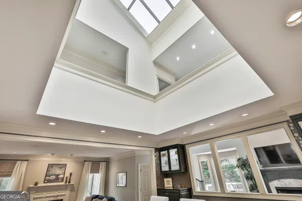 a bedroom with a bed and a night stand