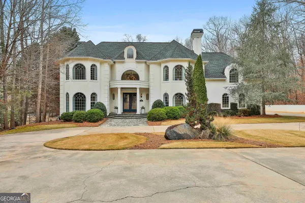 a view of a building with a snow on the road