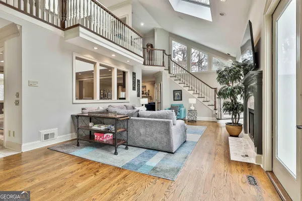 a living room with furniture and a rug
