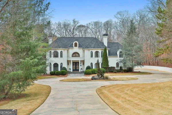 a view of empty room with wooden floor and floor to ceiling window