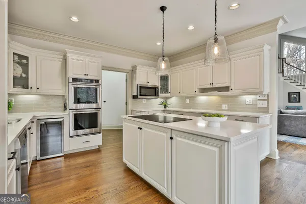 a bedroom with bed and a flat screen tv