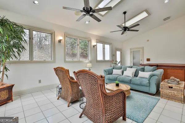 a bathroom with a toilet sink vanity and mirror