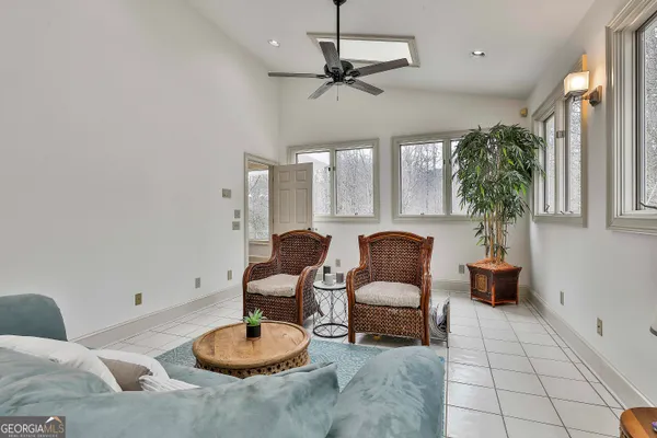 a aerial view of a house with swimming pool table and chairs