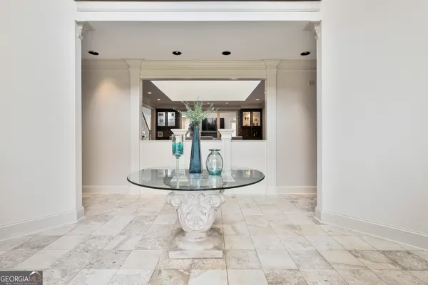 a view of a dining hall with furniture and wooden floor