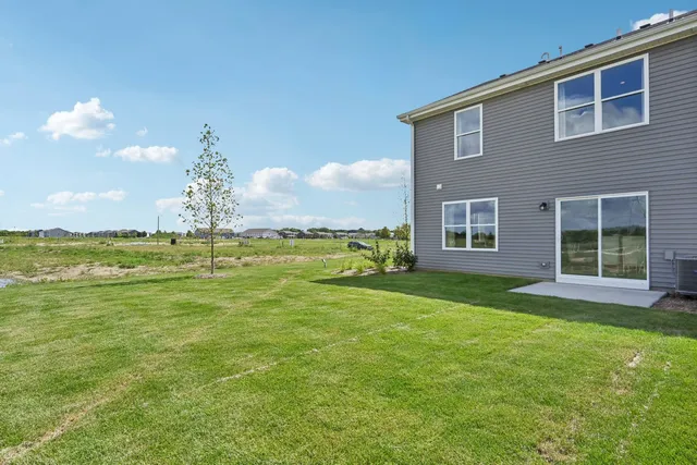 a house view with swimming pool in front of it