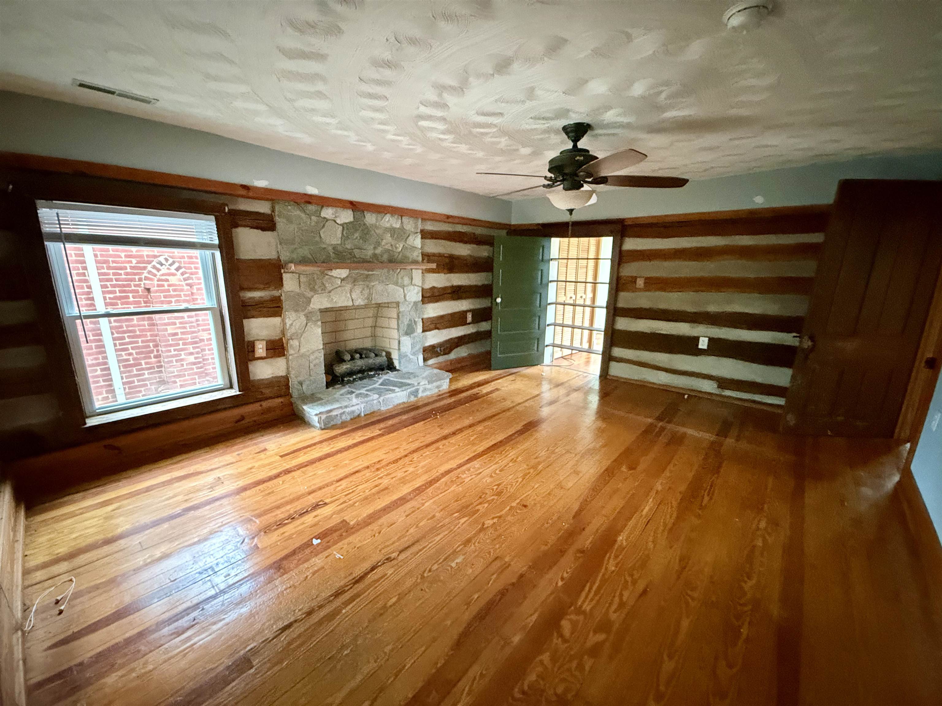 3648 Middlebrook Village Road Middlebrook, VA 24459 - Photo 18 of 48 wooden floor in an empty room with a fireplace