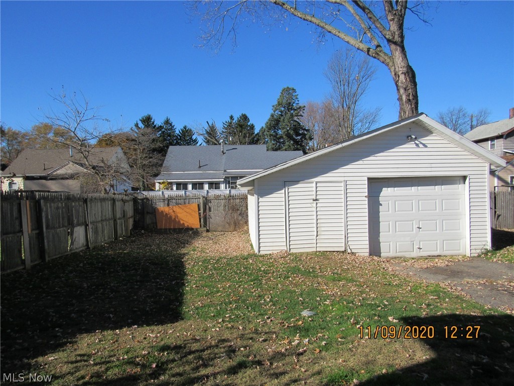 5309 Reed Avenue Ashtabula, OH 44004 - Photo 11 of 12 Back yard and one car garage with attached shed.