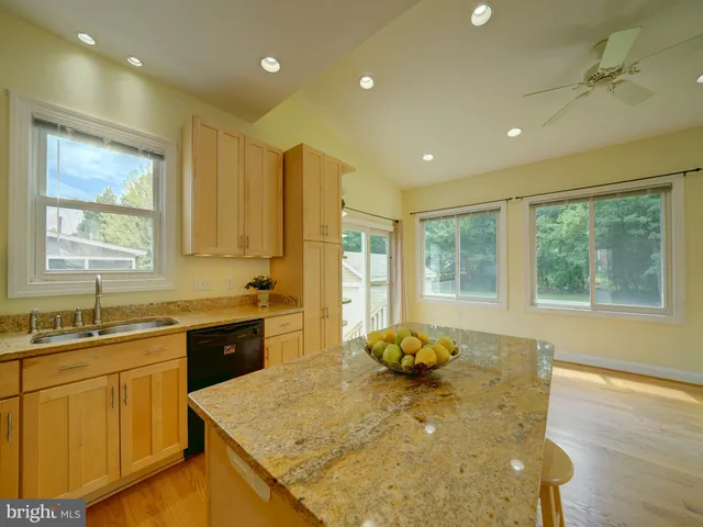 a bathroom with a sink a mirror and toilet