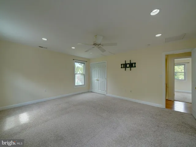 a view of an empty room and closet area