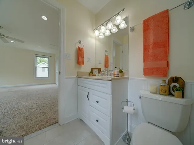 a view of a porch with furniture and a yard