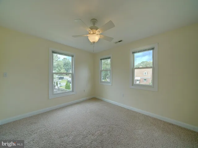 a front view of a house with a yard and porch