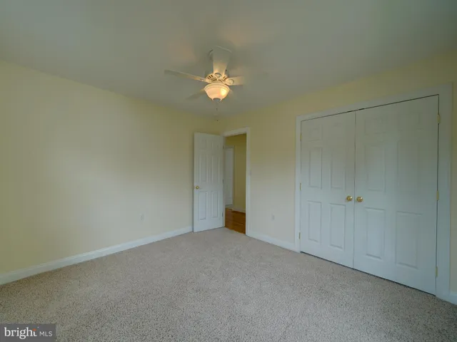 a view of a house with a yard and garage