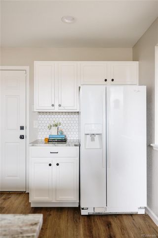 a white refrigerator freezer sitting in a kitchen