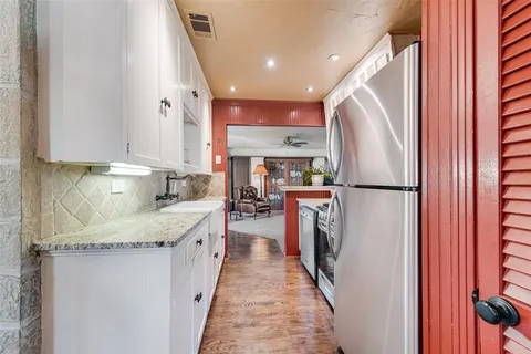 a kitchen with refrigerator and countertop