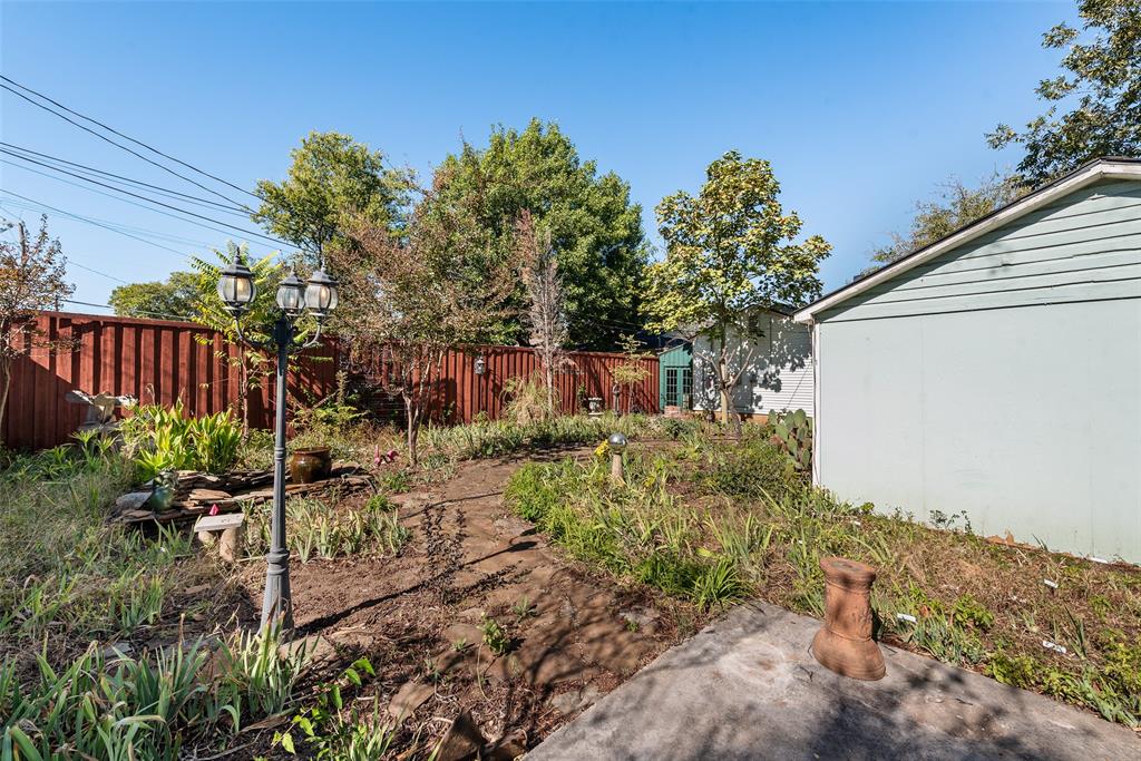 3022 Aster Street Dallas, TX 75211 - Photo 28 of 31 a view of a yard in front of a house
