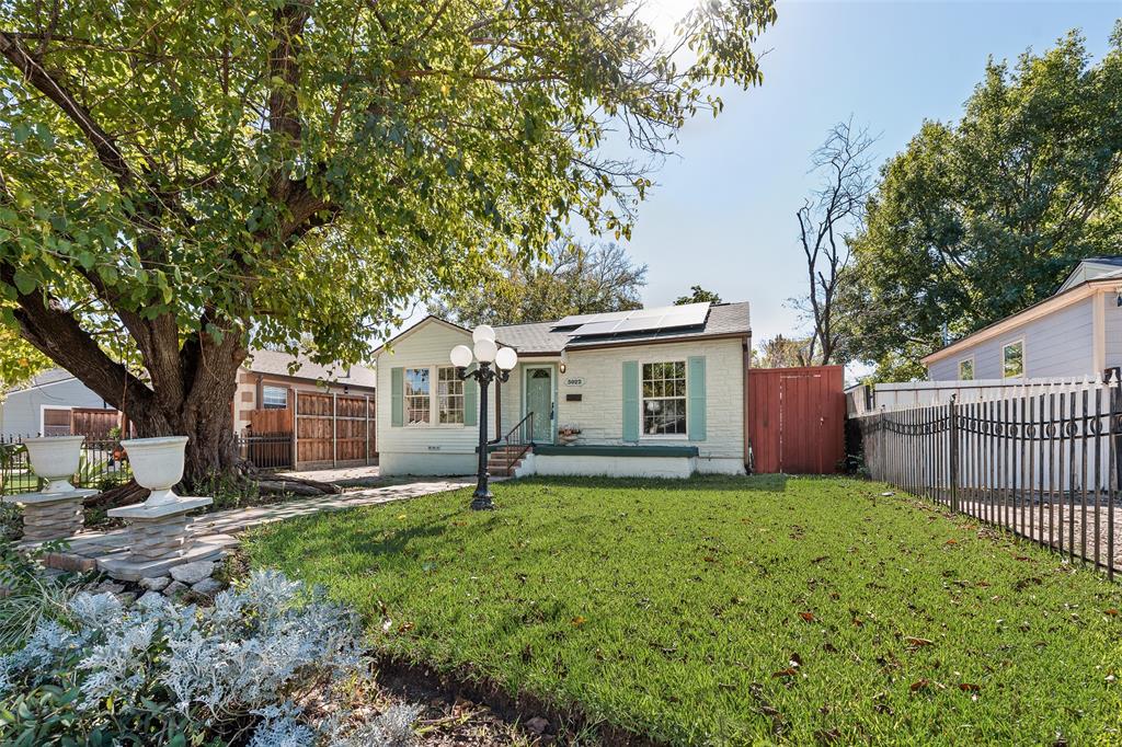 3022 Aster Street Dallas, TX 75211 - Photo 3 of 31 a front view of house with yard and green space