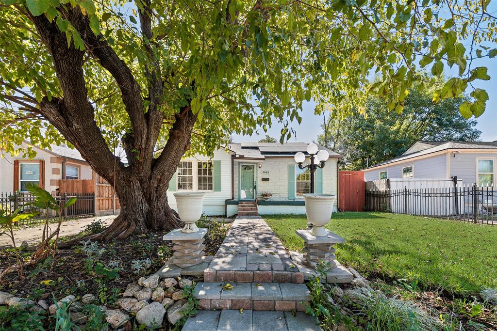 3022 Aster Street Dallas, TX 75211 - Photo 6 of 31 a front view of a house with garden