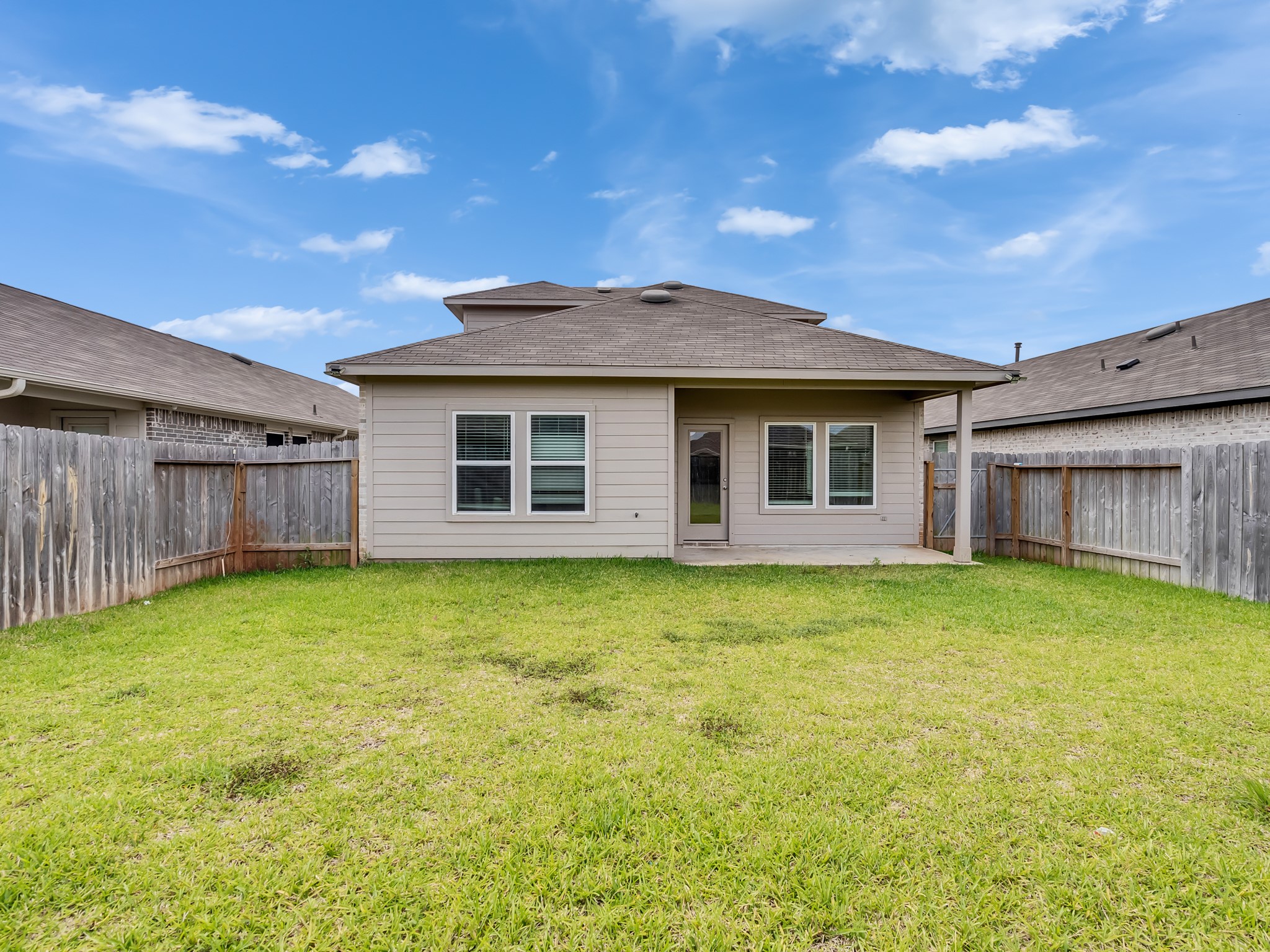 5431 Tuscany Hills Lane Spring, TX 77373 - Photo 3 of 22 a backyard of a house with yard table and chairs