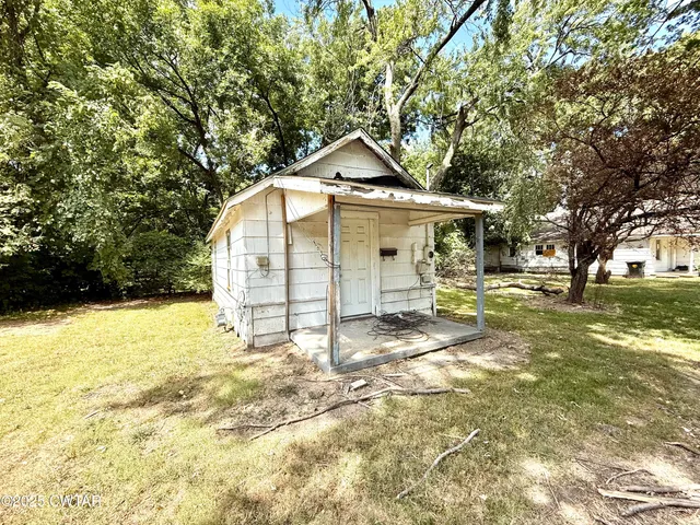 a house view with a garden space