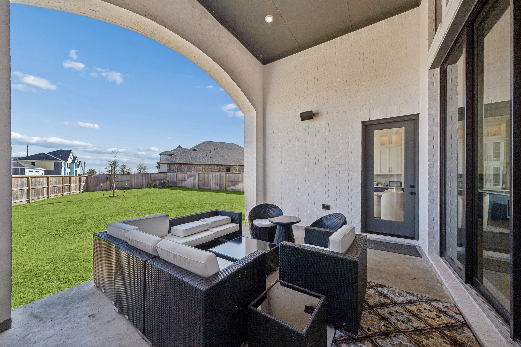 8703 Blue Grotto Lane Manvel, TX 77578 - Photo 32 of 43 The incredible covered patio with gas and water connections for your future outdoor kitchen.