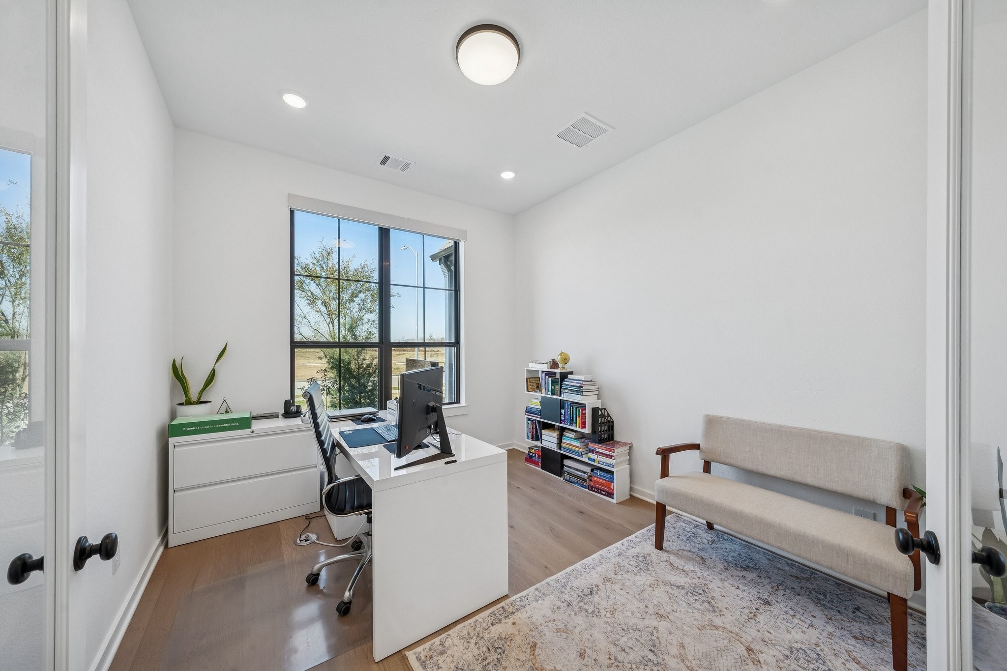 8703 Blue Grotto Lane Manvel, TX 77578 - Photo 5 of 43 The home office is large and privately placed at the front of the home, away from the living area.