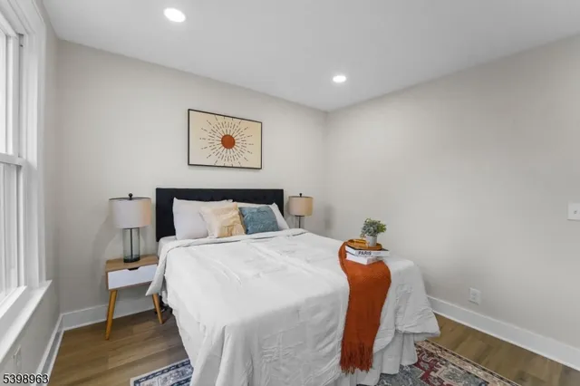 a bedroom with a bed and a table in it